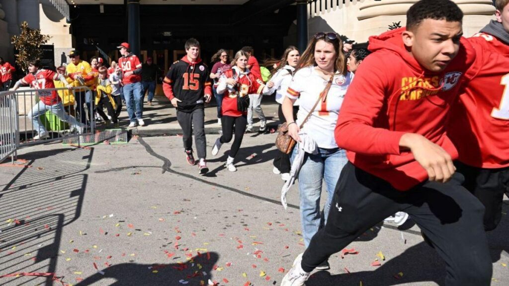 People flee after shots were fired near the Kansas City Chiefs' Super Bowl LVIII victory parade on February 14, 2024, in Kansas City, Missouri. A shooting incident at a packed parade Wednesday to celebrate the Kansas City Chiefs' Super Bowl victory killed one person and injured nine others, the city fire department said.