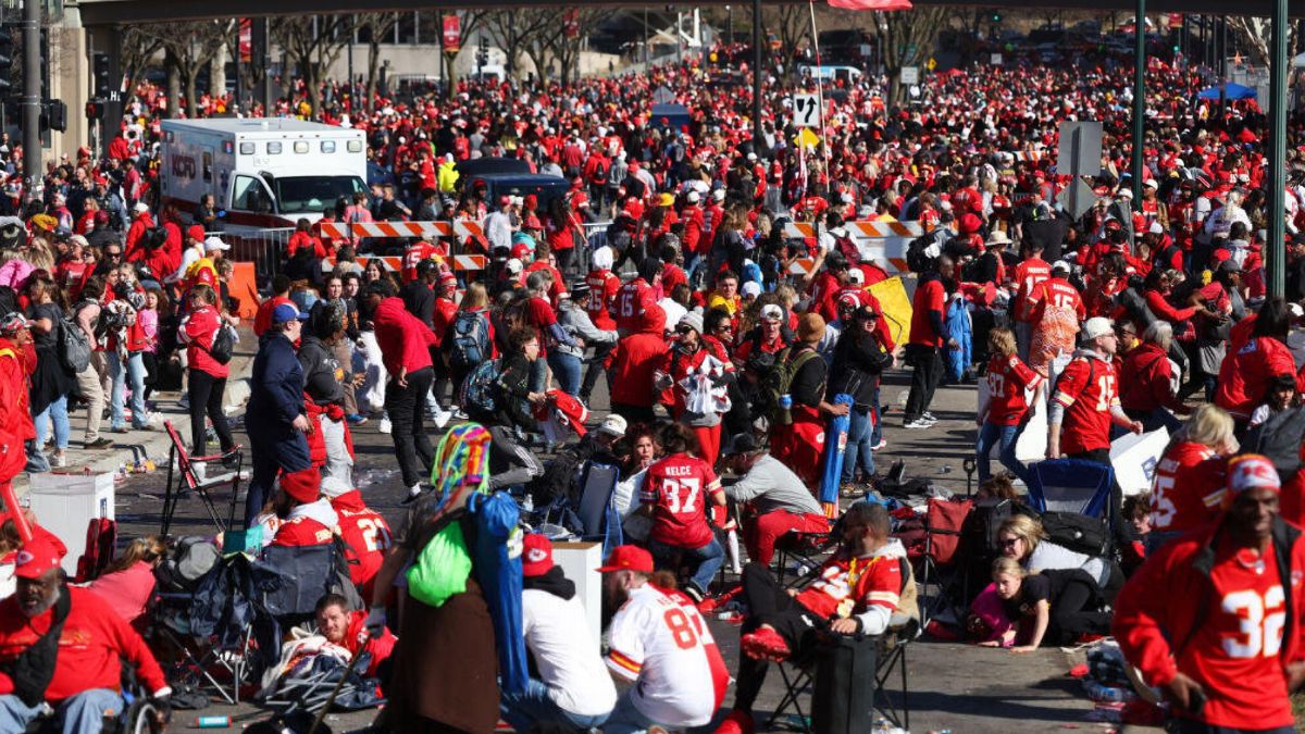 People take cover during a shooting at Union Station during the Kansas City Chiefs Super Bowl LVIII victory parade on February 14, 2024 in Kansas City, Missouri. Several people were shot and two people were detained after a rally celebrating the Chiefs Super Bowl victory.